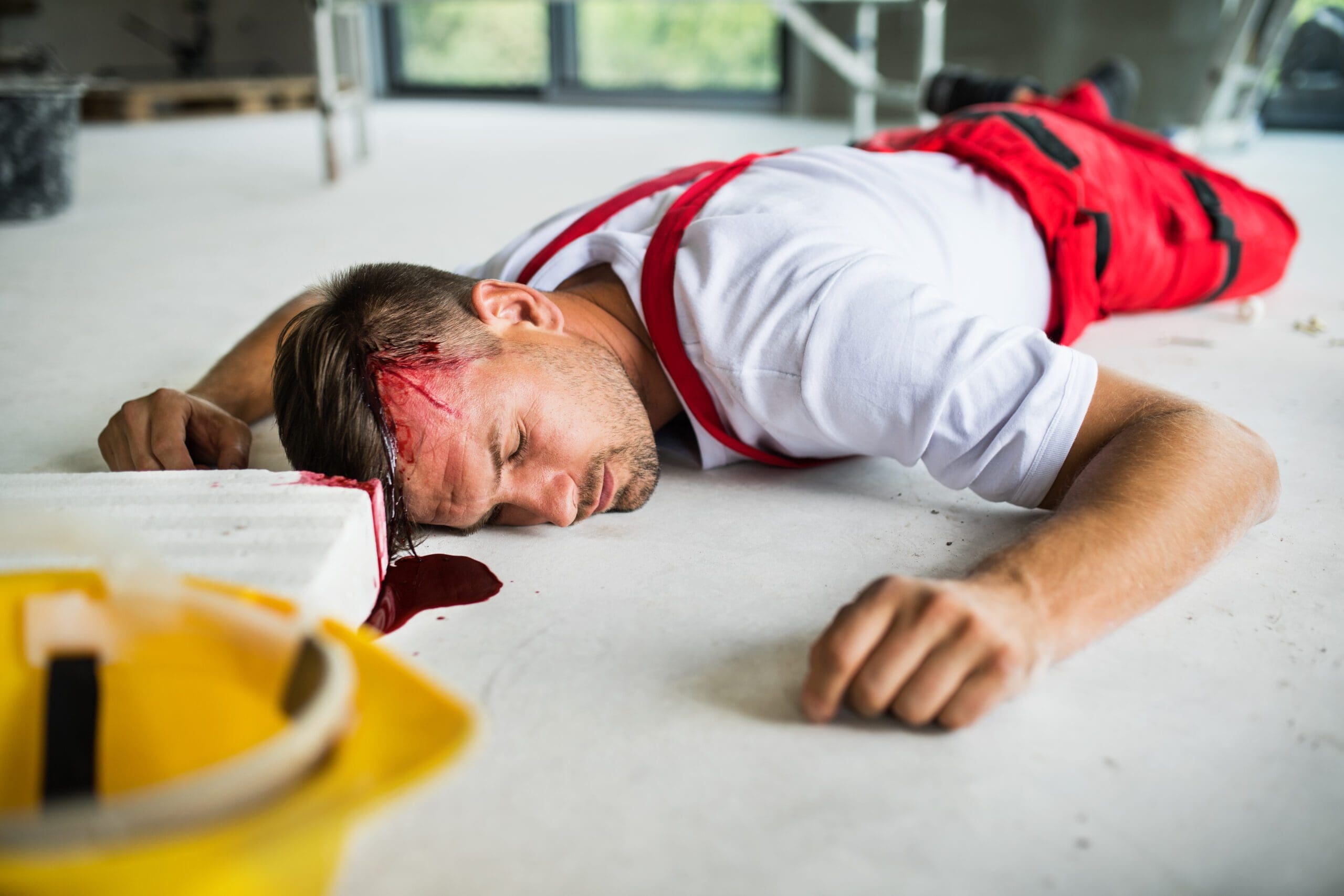 an-unconscious-man-worker-lying-on-the-floor-after-2021-08-26-12-08-57-utc-scaled.jpg